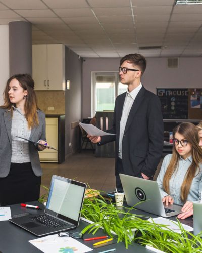 two people are standing and two people are sitting and discussion about seo packages